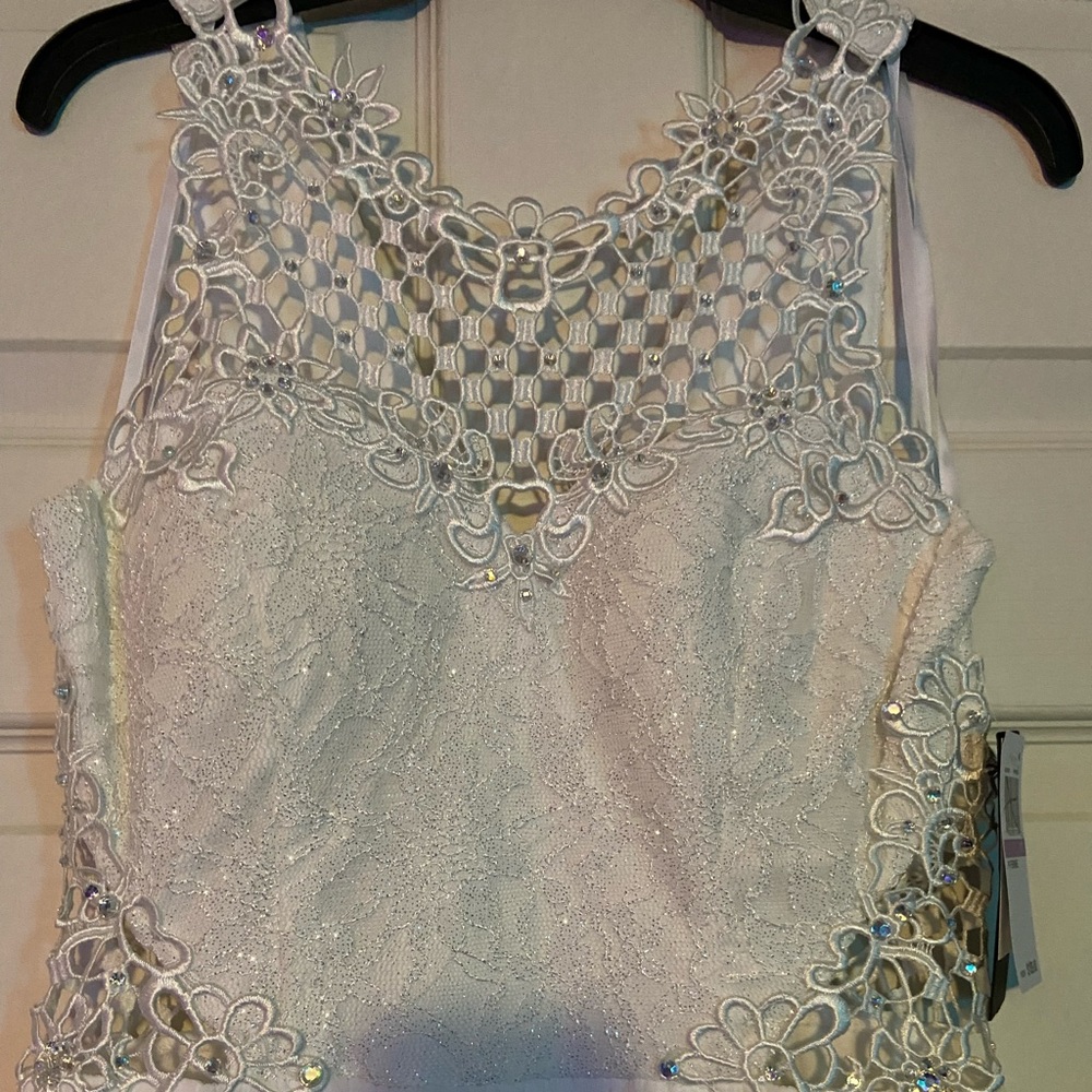 White wedding/prom dress. Size 11. Never worn, still has tags.